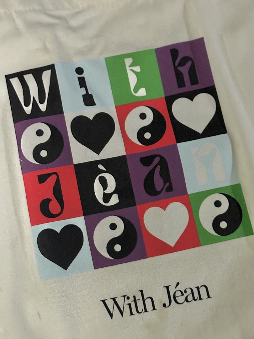 With Jean Tote Bag (Category: Tote Bags) located in Manila. Submitted by internetdreamgirl888 (Listing ID 1461422659, Image 2). Description: With Jéan Graphic Canvas Tote Bag ✔️ Authentic With Jéan tote ✔️ Large canvas tote bag ✔️ Features colorful graphic print with hearts and yin-yang motifs ✔️ Spacious enough for daily essentials, books, groceries, or errands ✔️ Long shoulder straps ✔️ Lightweight and reusable May request for more photos..