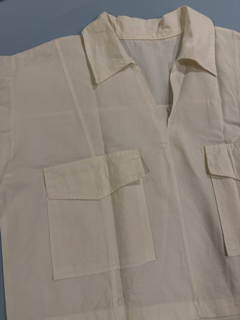 Womens Cropped Boxy Polo (Category: Shirts) located in Imus. Submitted by yummyfinds (Listing ID 1461486844, Image 2). Description: - Cream colored cropped shirt - Collared neckline - Two front pockets - Short sleeves - Breathable cotton blend fabric - Ideal for casual wear or layering - Simple and versatile design.