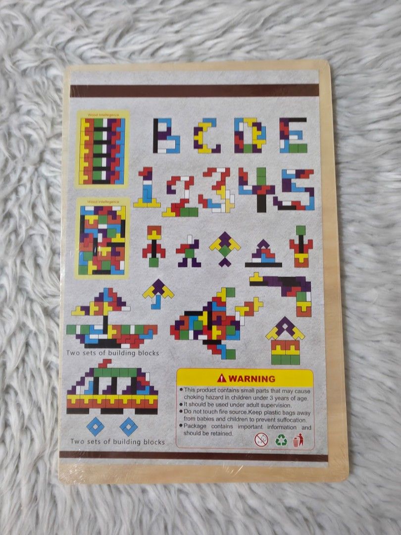 Wood Intelligence Building Blocks Puzzle Toy (Category: Educational & Learning Toys) located in Paranaque City. Submitted by dallecloset_ii (Listing ID 1461342924, Image 2). Description: Fun wooden puzzle with colorful blocks. Develops intelligence & creativity. Build many patterns. For kids & adults. Hours of fun!.