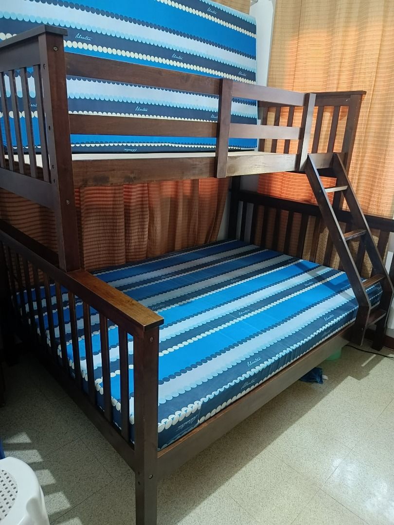 Wooden Bunk Bed with Mattresses (Category: Bed Frames & Mattresses) located in Carmona. Submitted by estelle01 (Listing ID 1461420995, Image 1). Description: - Solid wood bunk bed from SanYang (top single, bottom queen) - Dark brown finish - Includes two mattresses (Uratex brand) - Ladder attached on the right side - Sturdy construction - reinforced base and added plywood For Pick-up: Faith Street Cityland Subd., Carmona, Cavite PH 4116.