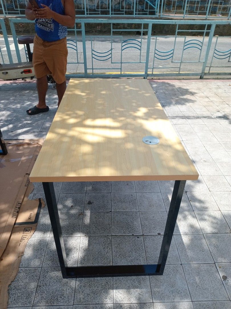 Wooden Table with Black Metal Frame (Category: Tables & Sets) located in Marikina City. Submitted by benjieremo75339 (Listing ID 1461493136, Image 2). Description: - Stylish wooden tabletop with a sleek black metal frame. - Built-in hole for convenient cable management. - Versatile use: ideal as a study desk or a compact dining table. - Solid and sturdy construction for lasting durability. - Looking for a new home – ready for its next owner!.