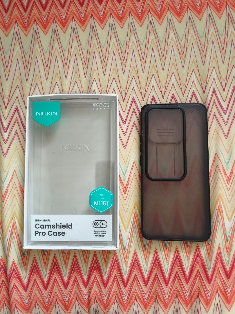 Xiaomi 15t Nillkin Case (Category: Cases & Sleeves) located in Paranaque City. Submitted by ryvsto (Listing ID 1461326305, Image 3). Description: for sale xiaomi 15t nillkin camshield pro case only fitted it as testing color: transparent black price: P350 FIRM (originally P567) rfs: too bulky for me, need funds • can do shipping (jnt or lalamove) • payment: ewallet (cod depending on courier) • if meetup: around lrt1 stations or paranaque area • l
