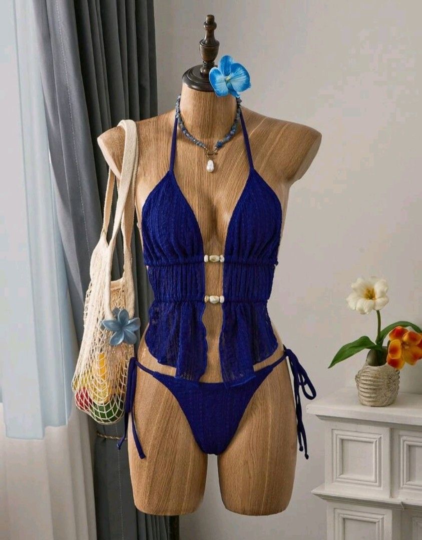 XS Blue Halter Neck Bikini Set (Category: Bikinis & Swimsuits) located in Makati City. Submitted by _gemelli (Listing ID 1461500829, Image 1). Description: - XS Navy Blue Halter Neck Tankini Top With Tie Back And Plain Bikini Bottom Swimwear Set - Halter neck top with tie-back closure - Used once - Ruffled peplum detail on top with decorative buttons - Comfortable and stylish design.