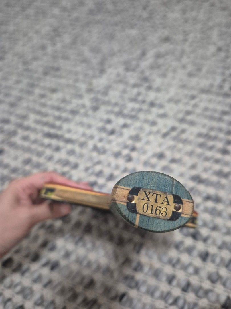 X-SPEED Table Tennis racket (Category: Other Sports Equipment and Supplies) located in Quezon City. Submitted by 53888 (Listing ID 1461487163, Image 3). Description: - X-SPEED table tennis bat - Red rubber on one side, black on the other - Handle features a blue and green design - Minor wear on the handle - Ideal for casual play.