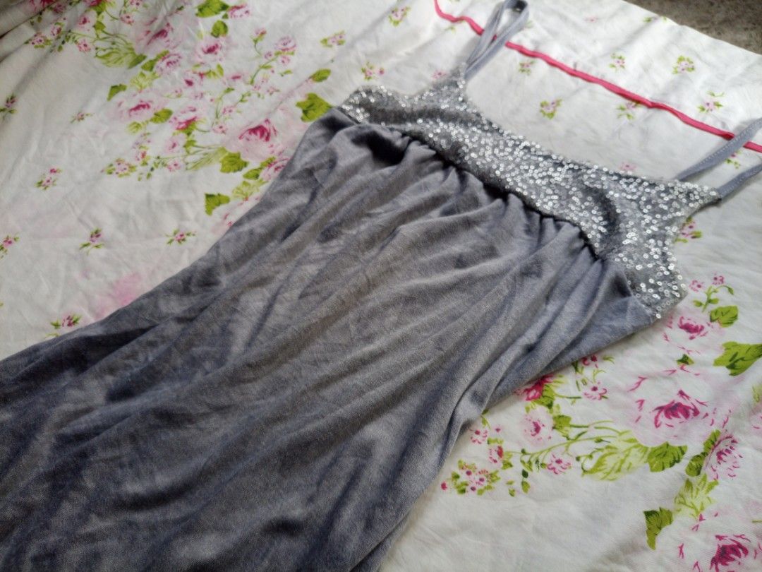 Y2k Spaghetti Strap Tank Top with Sequin Detail (Category: Sleeveless) located in Kalibo. Submitted by chinxecloset (Listing ID 1461502198, Image 2). Description: - Grey tank top - Thin spaghetti straps - Sparkly sequin detail on bust - Elasticated hem for a comfortable fit - Versatile for layering or wearing on its own - Casual and comfortable style.