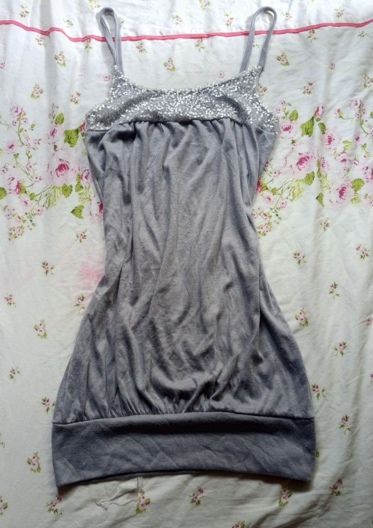 Y2k Spaghetti Strap Tank Top with Sequin Detail (Category: Sleeveless) located in Kalibo. Submitted by chinxecloset (Listing ID 1461502198, Image 1). Description: - Grey tank top - Thin spaghetti straps - Sparkly sequin detail on bust - Elasticated hem for a comfortable fit - Versatile for layering or wearing on its own - Casual and comfortable style.
