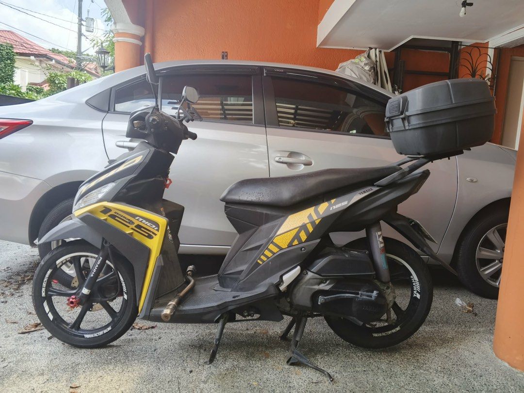 Yamaha Mio i 125 Motorcycle (Category: Motorbikes for Sale) located in Manila. Submitted by caballeroa11402 (Listing ID 1461489499, Image 1). Description: Yamaha Mio i 125. Yellow and black colorway. Has a top box installed. Odometer reads 74535 km. Ready for its next rider. Message for inquiries..