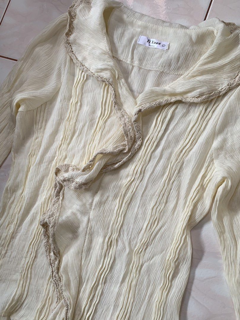 Yi Xuan Cream Ruffled Long Sleeve Blouse (Category: Blouses) located in Manila. Submitted by cottage.bloom (Listing ID 1461382314, Image 2). Description: @cottage.bloom on TikTok!.