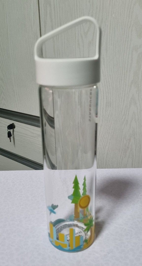 You are here collection piece california (Category: Water Bottles & Tumblers) located in Manila. Submitted by ags028705 (Listing ID 1461560666, Image 1). Description: - Cute clear water bottle - Features a fun cartoon design at the bottom (trees & buildings) - White carrying handle on top - Easy to hold and carry - Ideal for everyday use, travel, and staying hydrated on the go.