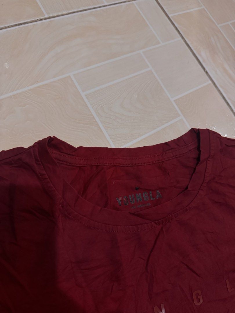 YOUNGLA T-shirt Maroon (Category: Tshirts & Polo Shirts ) located in Alaminos. Submitted by outfitcheck.ph (Listing ID 1461382885, Image 2). Description: - Maroon t-shirt with prominent YOUNGLA logo on the front. - Features short sleeves and a classic crew neck. - Crafted from soft, comfortable fabric for everyday wear. - Ideal for casual styling. - Refer to the care label for washing instructions..