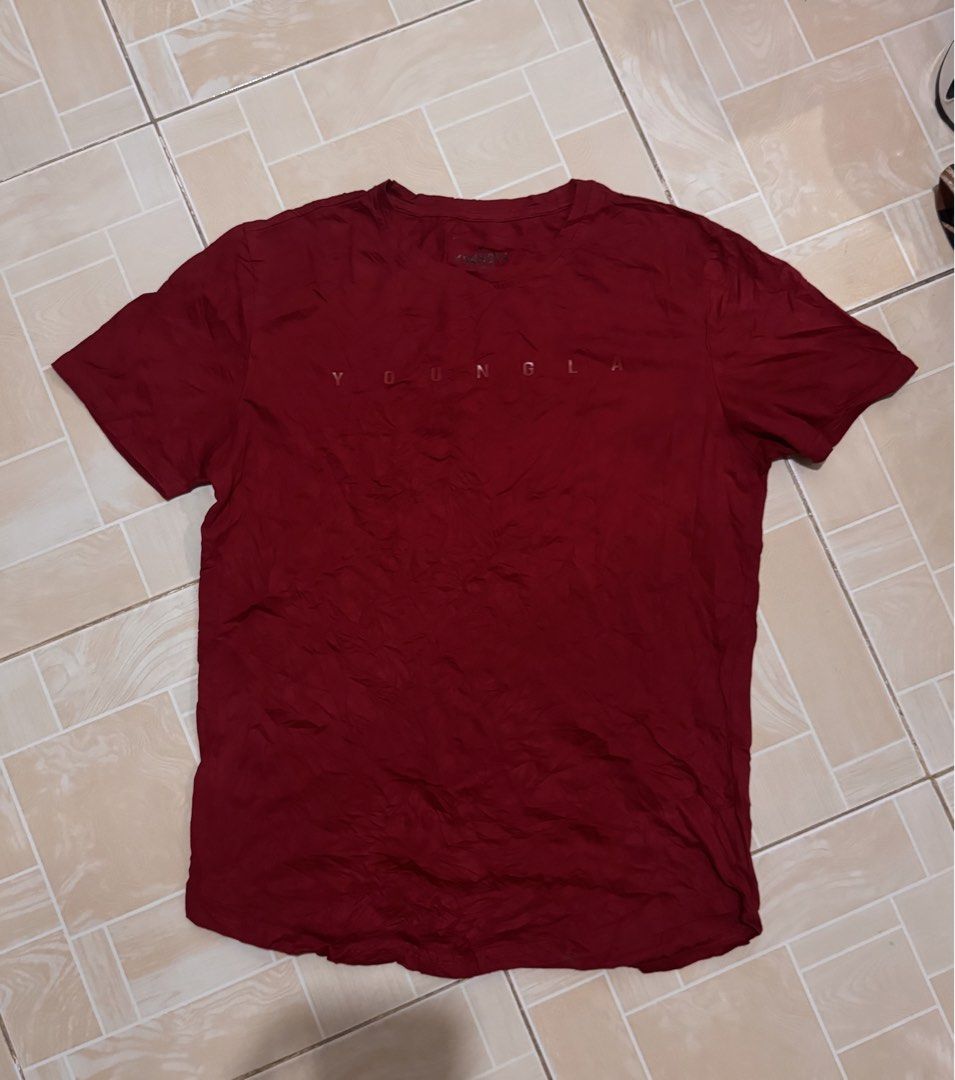 YOUNGLA T-shirt Maroon (Category: Tshirts & Polo Shirts ) located in Alaminos. Submitted by outfitcheck.ph (Listing ID 1461382885, Image 1). Description: - Maroon t-shirt with prominent YOUNGLA logo on the front. - Features short sleeves and a classic crew neck. - Crafted from soft, comfortable fabric for everyday wear. - Ideal for casual styling. - Refer to the care label for washing instructions..