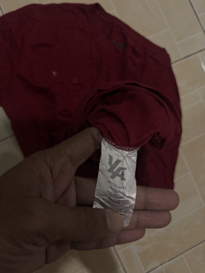 YOUNGLA T-shirt Maroon (Category: Tshirts & Polo Shirts ) located in Alaminos. Submitted by outfitcheck.ph (Listing ID 1461382885, Image 3). Description: - Maroon t-shirt with prominent YOUNGLA logo on the front. - Features short sleeves and a classic crew neck. - Crafted from soft, comfortable fabric for everyday wear. - Ideal for casual styling. - Refer to the care label for washing instructions..