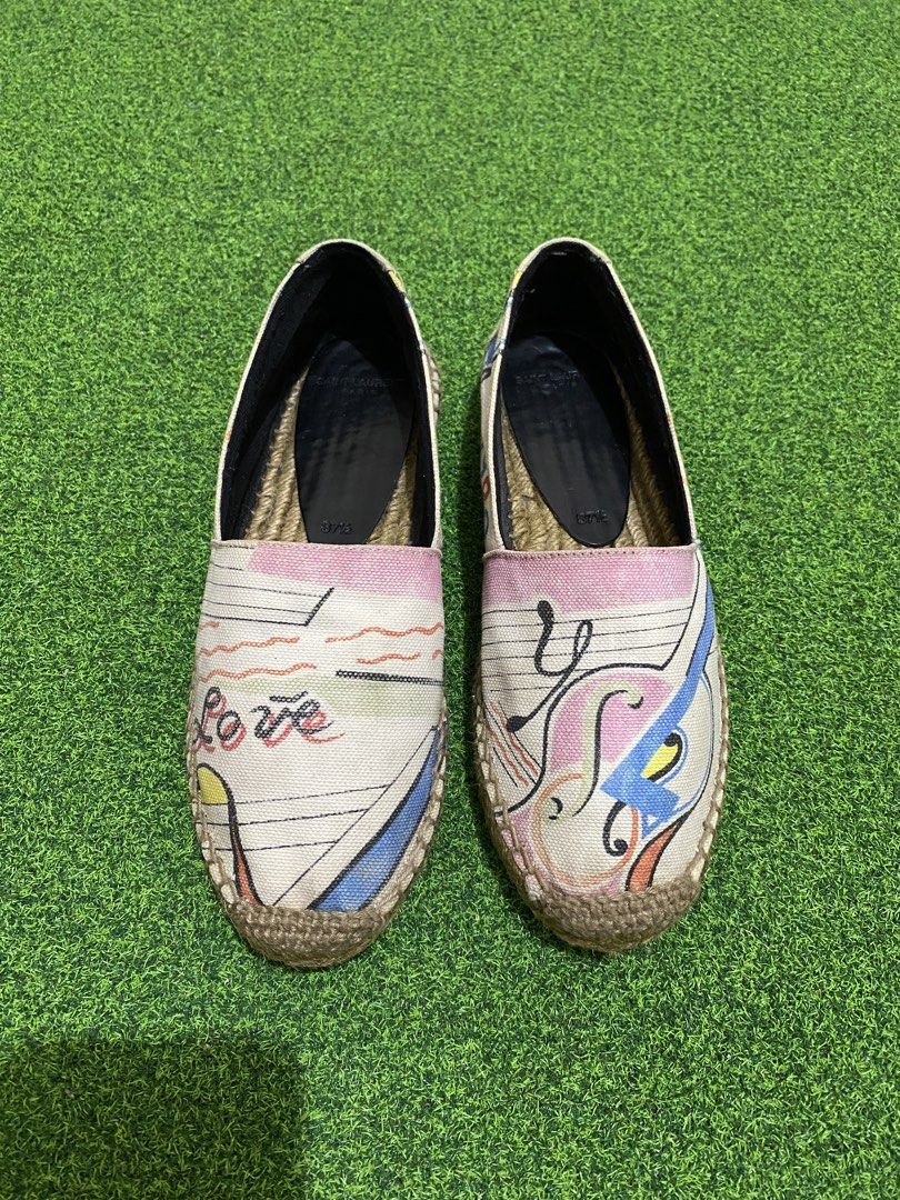 YSL Multicolor Printed Canvas Espadrilles (Category: Sneakers & Footwear) located in Manila. Submitted by victory_1816 (Listing ID 1461561882, Image 1). Description: A chic and distinctive pair of Saint Laurent espadrilles featuring a playful multicolor graphic print on canvas, classic slip-on silhouette, and natural braided jute espadrille sole. The colorful print gives this pair a unique, artistic character while remaining easy to style for cas