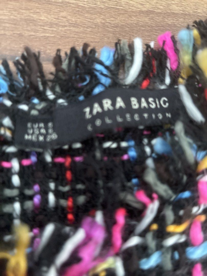 Zara Basic Collection Tweed Top (Category: Blouses) located in Pasig City. Submitted by slr1949 (Listing ID 1461561655, Image 2). Description: - Zara Basic tweed top - Short sleeves with frayed edges - Frayed hemline - Fun, textured fabric with black, pink, blue, yellow, and white threads - Adds a pop of color to your outfit.