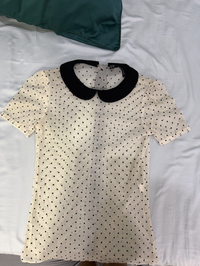 Zara Basic Polka Dot Peter Pan Collar Top (Category: Blouses) located in Rodriguez. Submitted by alekshivers (Listing ID 1461349410, Image 2). Description: - Zara Basic cream and black polka dot top - Peter Pan collar - Puff sleeves - Sheer material with polka dots - Made in Spain - Size XS.