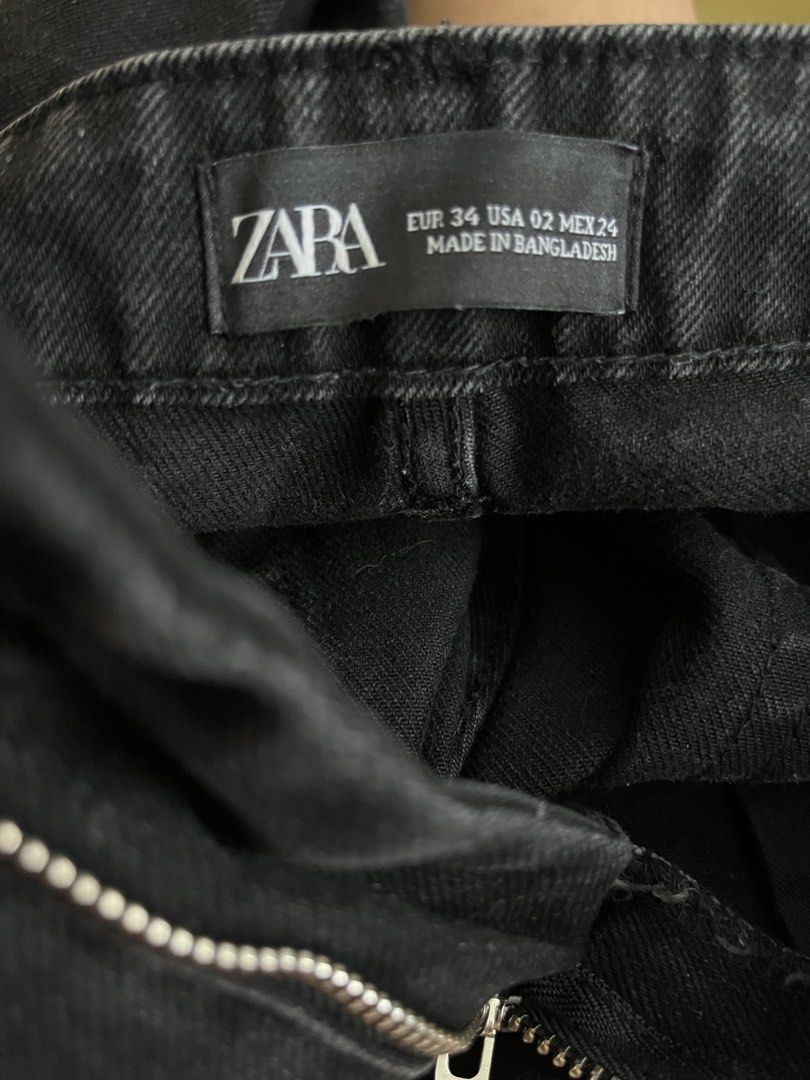 ZARA Black Denim Jeans (Category: Jeans) located in Dasmarinas. Submitted by aurapadilla00 (Listing ID 1461514059, Image 3). Description: - Brand: ZARA - Type: Black Denim Jeans - Style: High-waisted - Size: EUR 34 (USA 02, MEX 24) - Origin: Made in Bangladesh - Condition: Minor white speckles visible on fabric - Best for: Casual wear.