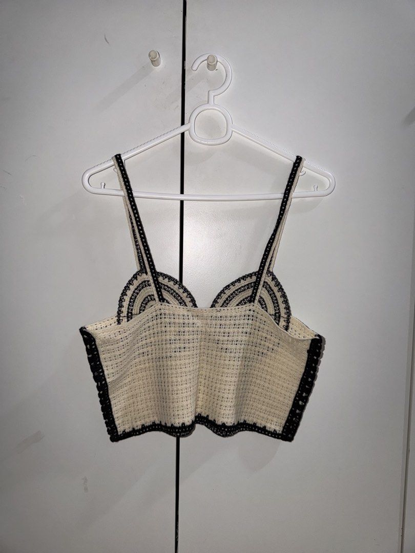 Zara Crochet Top (Category: Sleeveless) located in Manila. Submitted by closetbykiks (Listing ID 1461428169, Image 3). Description: Brand: ZARA Size: Medium (EUR M / USA M / MEX 28) Color: Cream / Off-White with Black contrast trim Style: Cropped cami top, thin shoulder straps, structured bust outline Pattern: Open crochet / knit weave Condition: Excellent pre-owned condition Styling Suggestion: Pair with high-waisted linen trousers, denim shorts