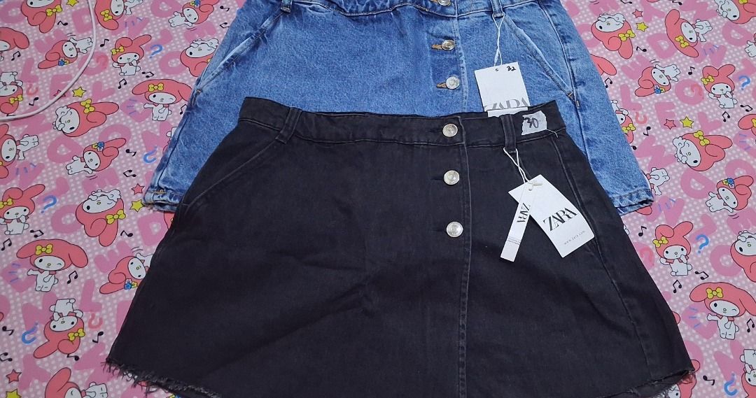 ZARA Denim Skirt - Black & Blue (Category: Skirts) located in Manila. Submitted by katkween23 (Listing ID 1461448603, Image 1). Description: - Two ZARA denim skirts: 1 black, 1 blue wash. - Features button-front closure. - Trendy frayed hem detail. - Ideal for casual outfits. - Don't miss out!.
