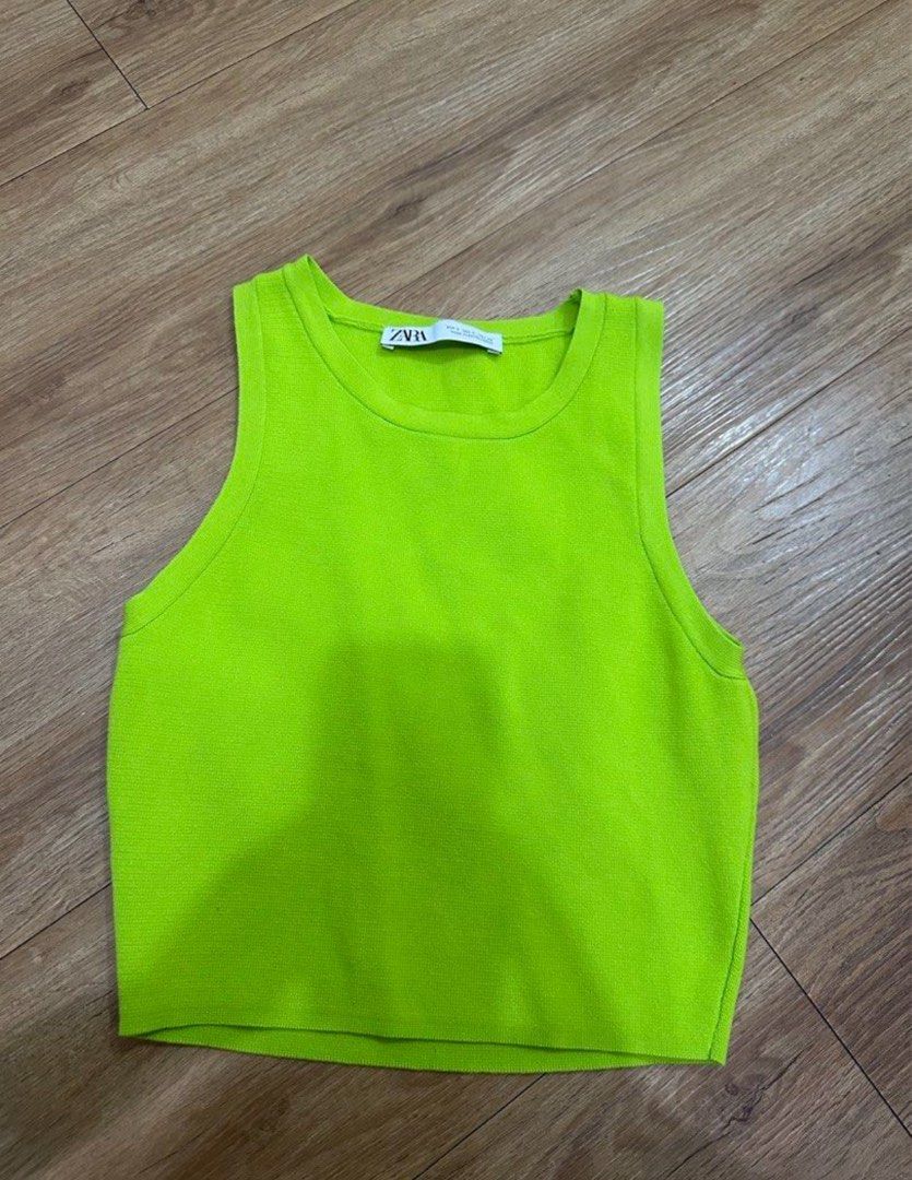 Zara Neon Green Knit Top (Category: Sleeveless) located in Las Pinas. Submitted by gg_1968 (Listing ID 1461329548, Image 1). Description: - Zara neon green knit tank top - Ribbed texture - Racerback style - Versatile for layering or wearing on its own - Easy to pair with jeans or shorts.