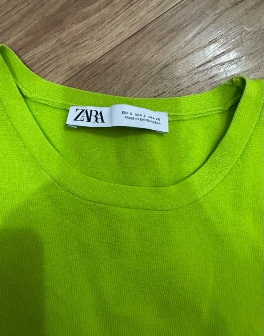 Zara Neon Green Knit Top (Category: Sleeveless) located in Las Pinas. Submitted by gg_1968 (Listing ID 1461329548, Image 2). Description: - Zara neon green knit tank top - Ribbed texture - Racerback style - Versatile for layering or wearing on its own - Easy to pair with jeans or shorts.
