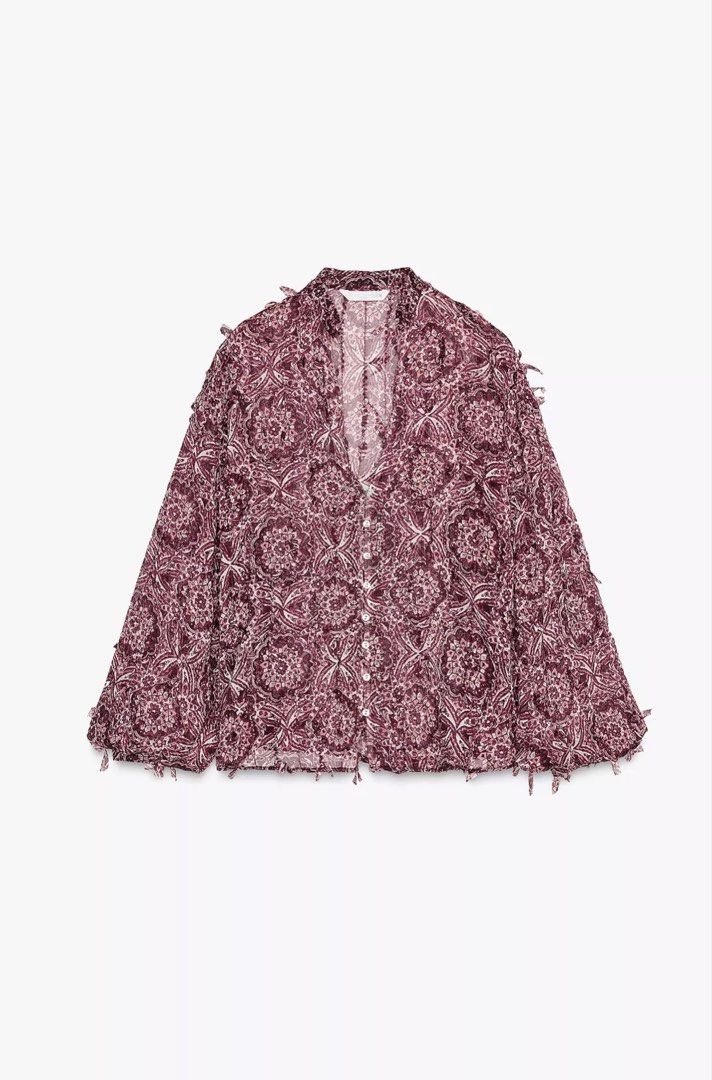 Zara Printed Blouse with Tassel Details (Category: Blouses) located in Iloilo. Submitted by dabyladaby2 (Listing ID 1461498266, Image 1). Description: - Zara burgundy and white printed blouse - Unique tassel details on sleeves and hem - Button-up front - Estimated size: Small - Perfect for dressing up or down.