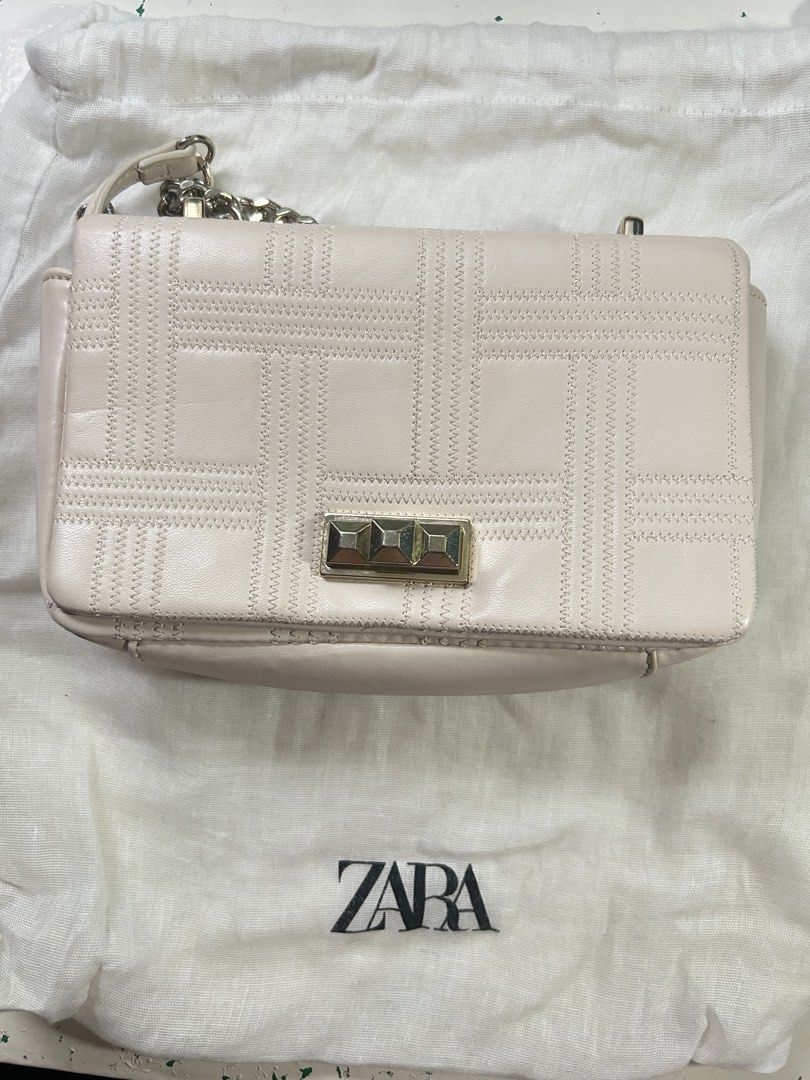 Zara Quilted Chain Shoulder Bag (Category: Shoulder Bags) located in Manila. Submitted by shivroy48 (Listing ID 1461337114, Image 1). Description: - Light pink Zara shoulder bag - Quilted pattern - Gold-tone turn-lock closure - Leather and metal chain strap - Comes with Zara dust bag - Versatile for casual or dressed-up looks.