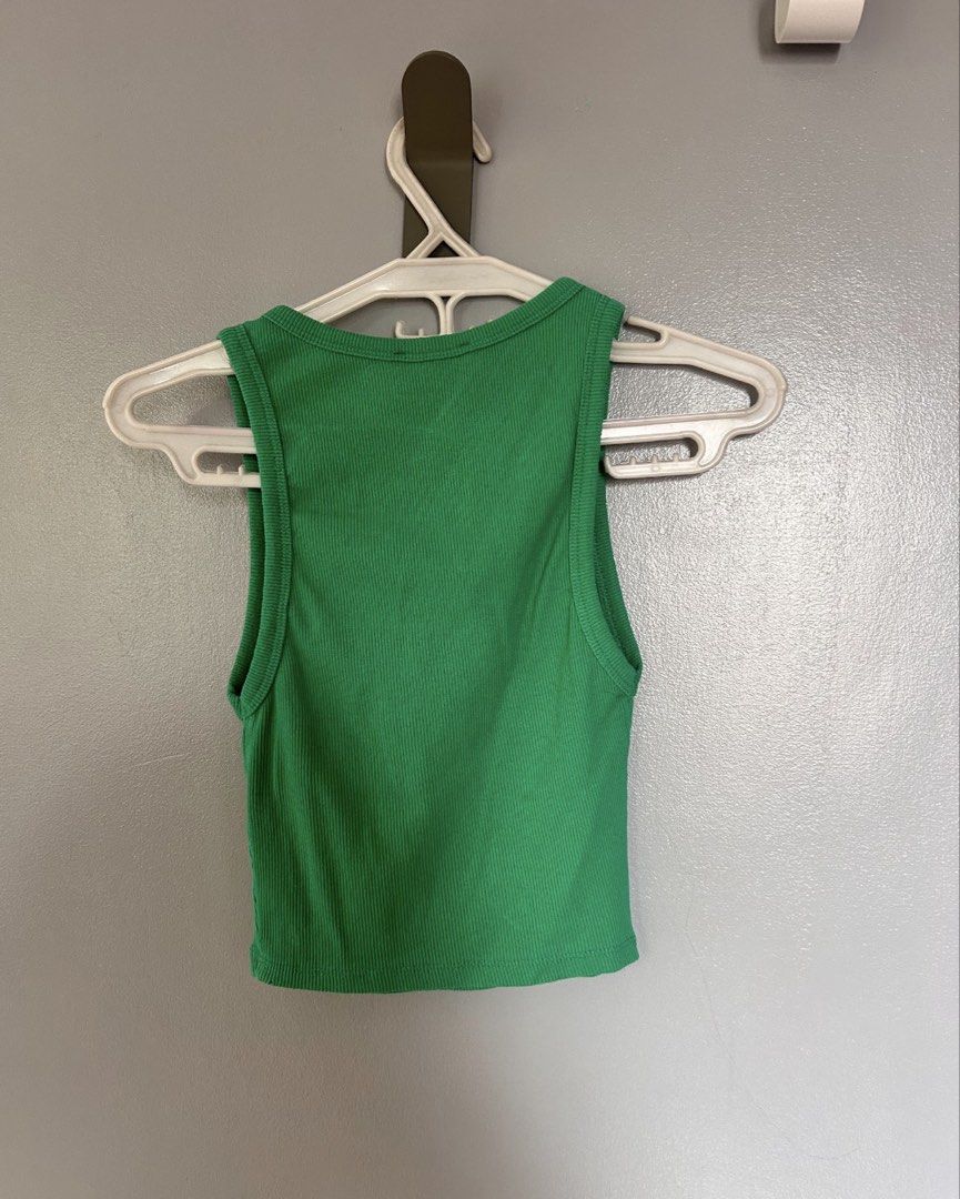 Zara Ribbed Tank Top Green (Category: Sleeveless) located in Paranaque City. Submitted by glvillz (Listing ID 1461560724, Image 2). Description: - tag says M but fits xs-s better! - Zara green ribbed tank top - Sleeveless with round neckline - Comfortable and stretchy material - Versatile for layering or standalone wear - Pairs easily with jeans or shorts.
