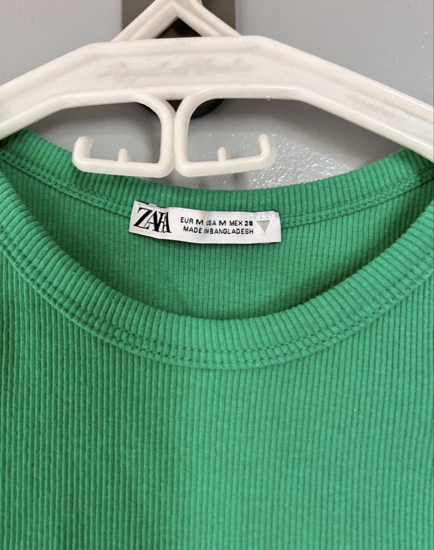 Zara Ribbed Tank Top Green (Category: Sleeveless) located in Paranaque City. Submitted by glvillz (Listing ID 1461560724, Image 3). Description: - tag says M but fits xs-s better! - Zara green ribbed tank top - Sleeveless with round neckline - Comfortable and stretchy material - Versatile for layering or standalone wear - Pairs easily with jeans or shorts.