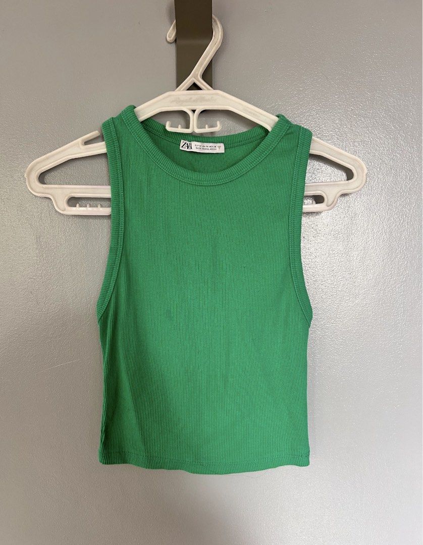 Zara Ribbed Tank Top Green (Category: Sleeveless) located in Paranaque City. Submitted by glvillz (Listing ID 1461560724, Image 1). Description: - tag says M but fits xs-s better! - Zara green ribbed tank top - Sleeveless with round neckline - Comfortable and stretchy material - Versatile for layering or standalone wear - Pairs easily with jeans or shorts.