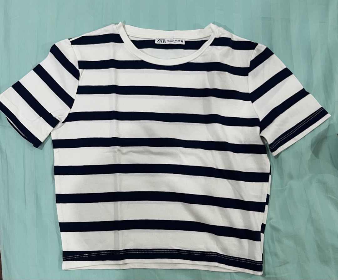 Zara Striped T-shirt (Category: Shirts) located in Manila. Submitted by joy.declutters.ph (Listing ID 1461511830, Image 1). Description: - Classic navy and white striped t-shirt from Zara - Short sleeves - Crew neck - Versatile and great for casual wear - Pairs well with jeans or shorts.