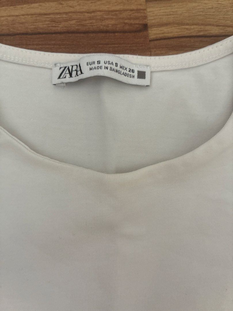 Zara White Sleeveless Cropped Top Size S (Category: Sleeveless) located in Pasig City. Submitted by slr1949 (Listing ID 1461561466, Image 2). Description: - White Zara top - Sleeveless design - Cropped length - Made in Bangladesh - Size S - Simple and versatile - Great for layering or wearing on its own.