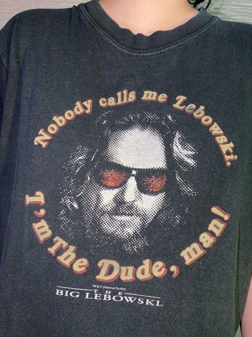 2000's Vintage The Big Lebowski The Dude Tee (Category: Tshirts & Polo Shirts ) located in Quezon City. Submitted by theiiclothing (Listing ID 1461703168, Image 1). Description: 2000's Vintage The Big Lebowski The Dude Tee Size (width: 21 inches x length: 25.5 inches) 400PHP ONLY! DM us for reservations or further inquiries. For sure buyers, comment “mine” on this pic Stay blessed to be dressed! 🙏.
