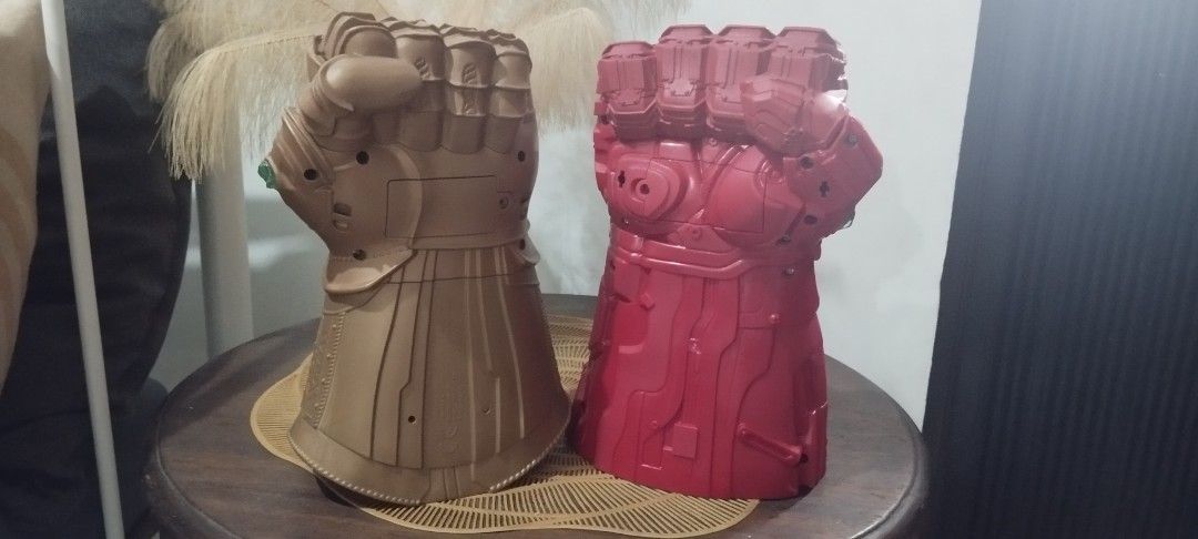 2019 Marvel Infinity Gauntlet - Gold and Red (Category: Western Merchandise) located in Manila. Submitted by ventajetoyz625 (Listing ID 1461564401, Image 3). Description: - Two Infinity Gauntlet all in. - One gold gauntlet with colored gems; working repaired light effects; no sound effect - One red gauntlet with yellow accents; all working condition - Ideal for Marvel fans, kids, and collectors. - Great addition to any collection. - Buy both for 