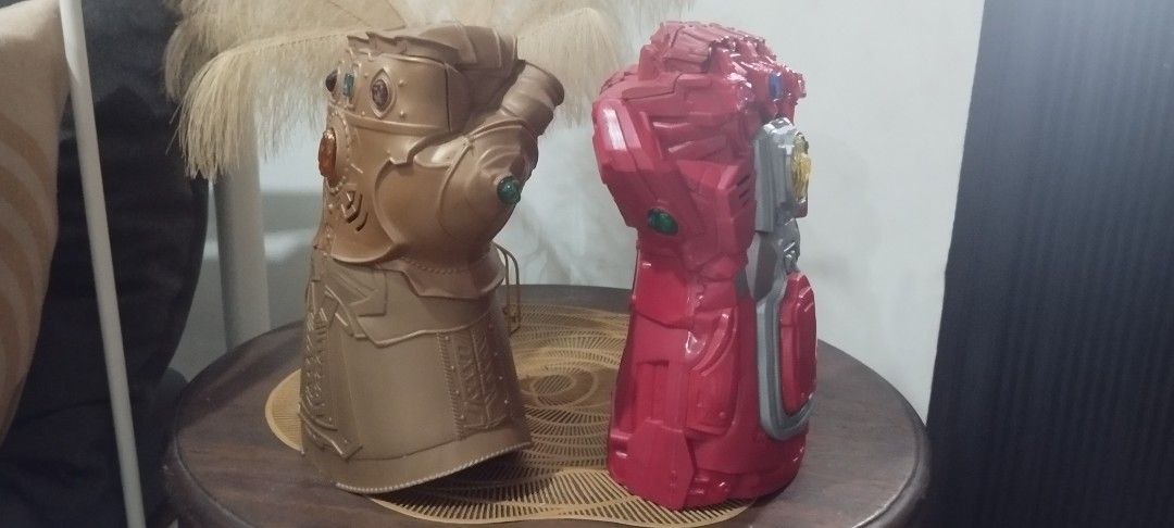 2019 Marvel Infinity Gauntlet - Gold and Red (Category: Western Merchandise) located in Manila. Submitted by ventajetoyz625 (Listing ID 1461564401, Image 2). Description: - Two Infinity Gauntlet all in. - One gold gauntlet with colored gems; working repaired light effects; no sound effect - One red gauntlet with yellow accents; all working condition - Ideal for Marvel fans, kids, and collectors. - Great addition to any collection. - Buy both for 