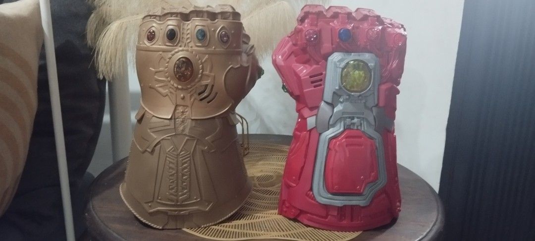 2019 Marvel Infinity Gauntlet - Gold and Red (Category: Western Merchandise) located in Manila. Submitted by ventajetoyz625 (Listing ID 1461564401, Image 1). Description: - Two Infinity Gauntlet all in. - One gold gauntlet with colored gems; working repaired light effects; no sound effect - One red gauntlet with yellow accents; all working condition - Ideal for Marvel fans, kids, and collectors. - Great addition to any collection. - Buy both for 
