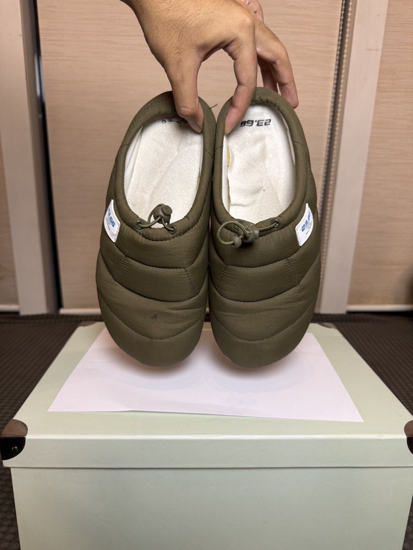 23.65 Olive Green Puffer Slippers (Category: Slippers & Slides) located in Manila. Submitted by kuyascloset (Listing ID 1461692032, Image 3). Description: - Brand: 23.65 - Color: Olive Green - Style: Puffer slippers - Closure: Easy slip-on with drawstring at the back - Comfort: Warm and comfortable for lounging - Condition: Soles show minor wear - Usage: Great for indoor or casual outdoor use.