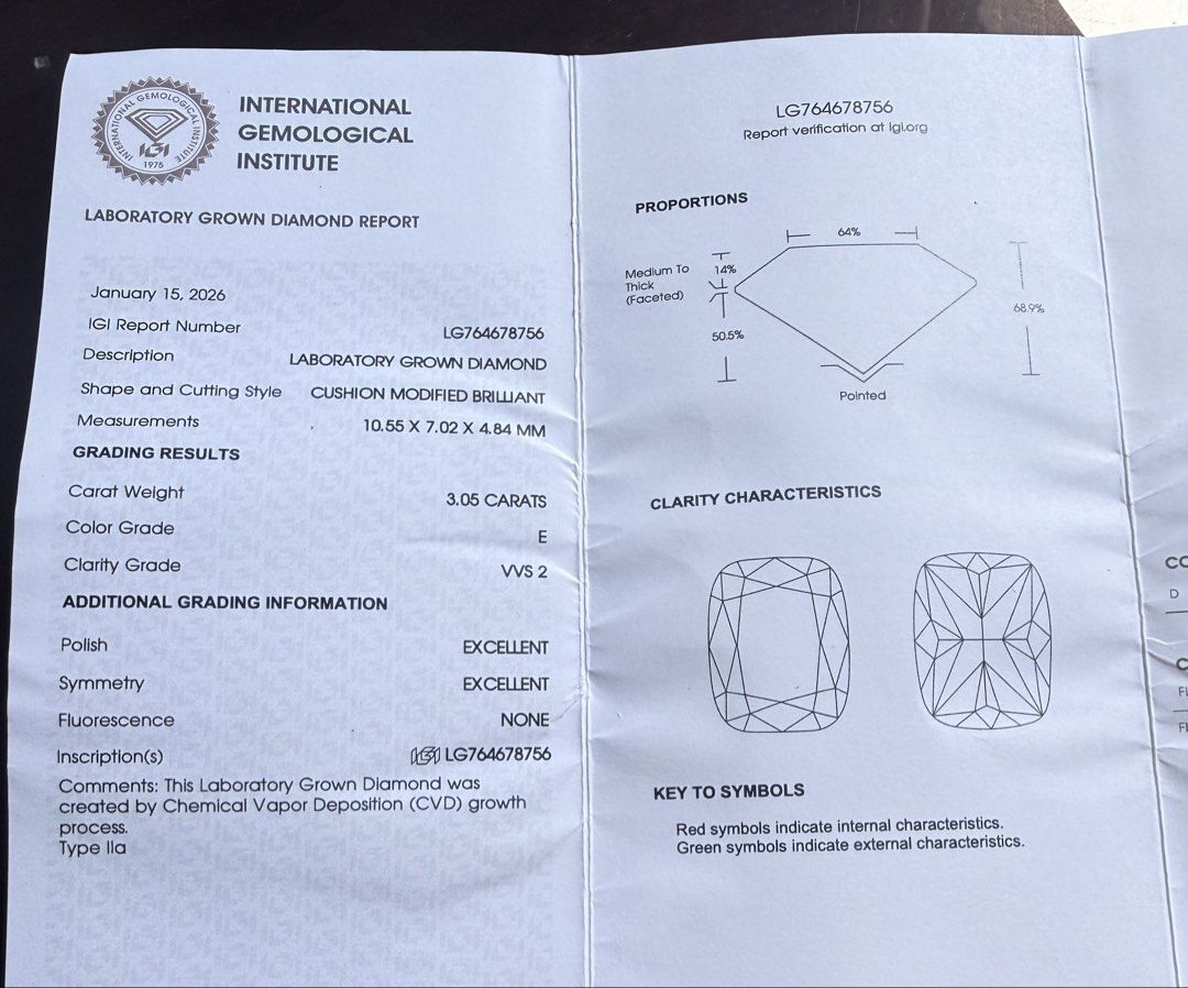 3.05ct Cushion Modified Brilliant Lab Grown Diamond Ring (Category: Rings) located in Silang. Submitted by sashamonster (Listing ID 1461629592, Image 3). Description: - IGI Certified Lab Grown Diamond: 3.05 carats - Cut: Cushion Modified Brilliant - Color: E (Colorless) - Clarity: VVS2 (Very, Very Slightly Included) - Polish & Symmetry: Excellent - Diamond Type: Lab Grown (CVD) - Setting: Beautiful band with smaller accent diamonds - Includes: Or