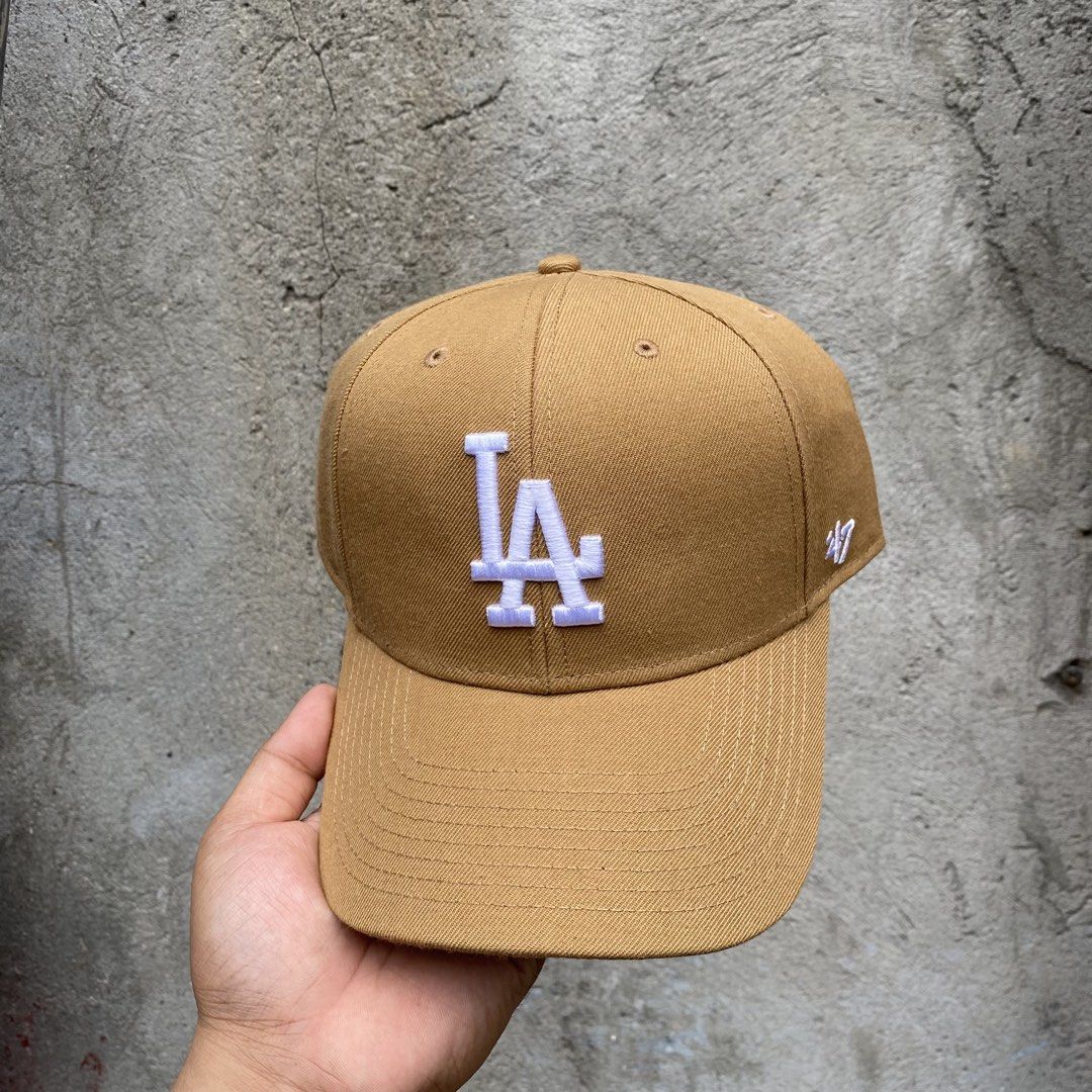 47 Brand LA Dodgers Baseball Cap Tan (Category: Caps & Hats) located in Manila. Submitted by blingdrop (Listing ID 1461732710, Image 1). Description: - Authentic 47 Brand LA Dodgers Cap - Features white embroidered 'LA' logo on the front - 'Los Angeles' embroidered on the adjustable back strap - Classic baseball cap design - Perfect for any Los Angeles Dodgers fan.