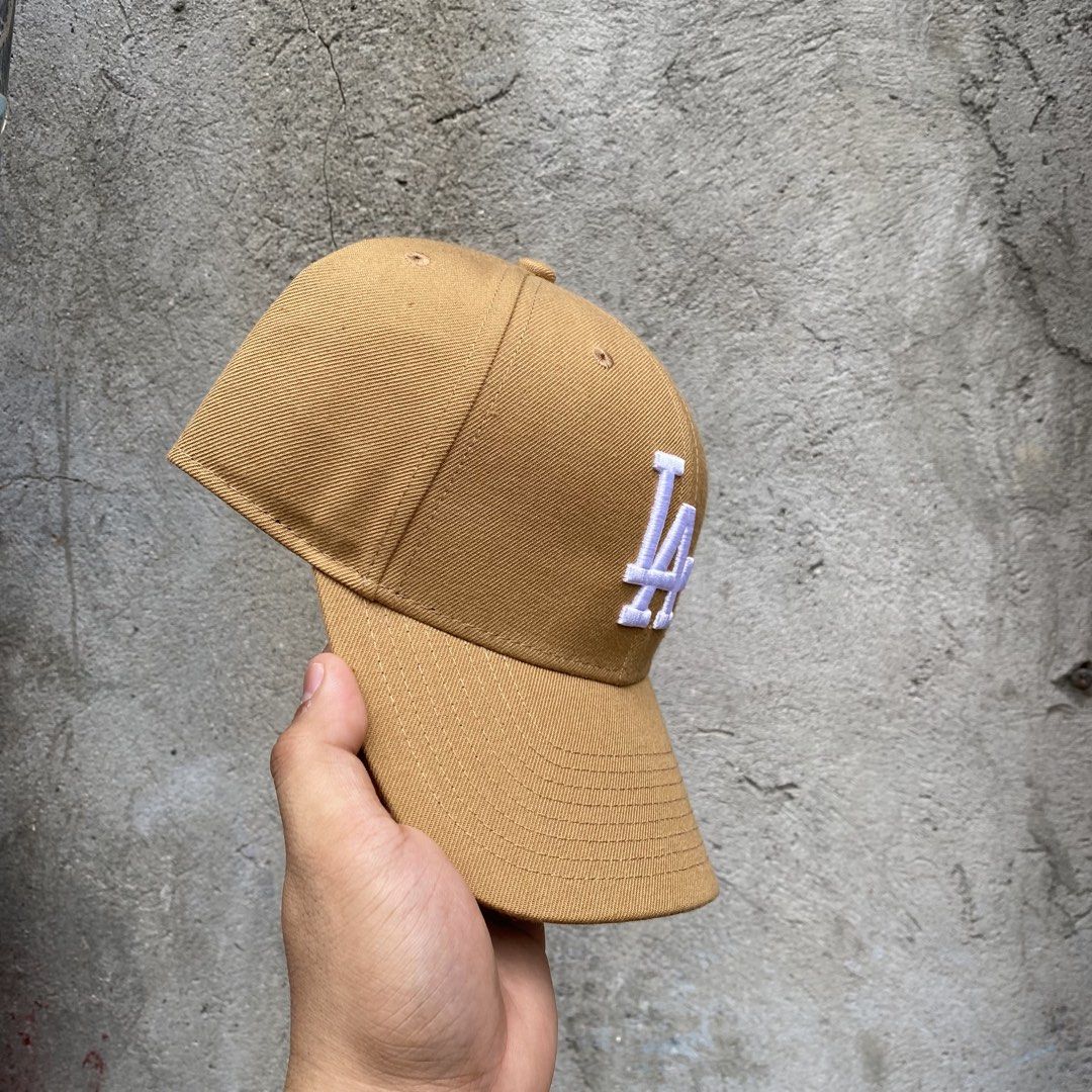 47 Brand LA Dodgers Baseball Cap Tan (Category: Caps & Hats) located in Manila. Submitted by blingdrop (Listing ID 1461732710, Image 2). Description: - Authentic 47 Brand LA Dodgers Cap - Features white embroidered 'LA' logo on the front - 'Los Angeles' embroidered on the adjustable back strap - Classic baseball cap design - Perfect for any Los Angeles Dodgers fan.