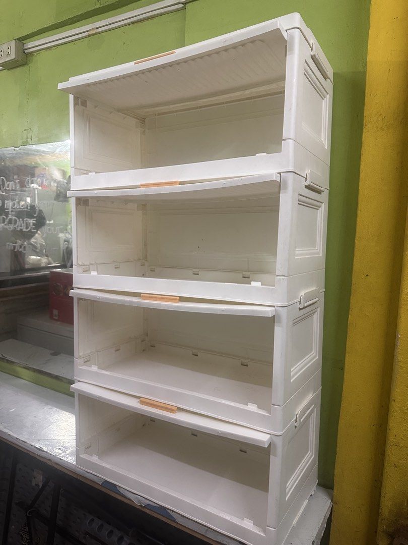 4-Tier Stackable Storage Cabinet with Drawers (Category: Shelves, Cabinets & Racks) located in Manila. Submitted by zuripot0726 (Listing ID 1461714854, Image 1). Description: - White plastic storage cabinet with 4 drawers - Each drawer features a stylish wooden handle - Perfect for organizing small items, snacks, or supplies - Drawers are stackable and can be easily removed - Simple to clean and convenient to move around - Versatile for home or s