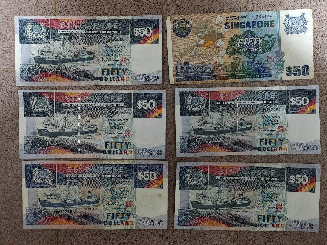 50 notes (Category: Currency) located in Singapore. Submitted by logoh (Listing ID 1461744728, Image 1). Description: - Collection of Singapore $50 notes - Genuine legal tender - Features iconic Singapore ship and skyline design - Suitable for collectors or currency enthusiasts.