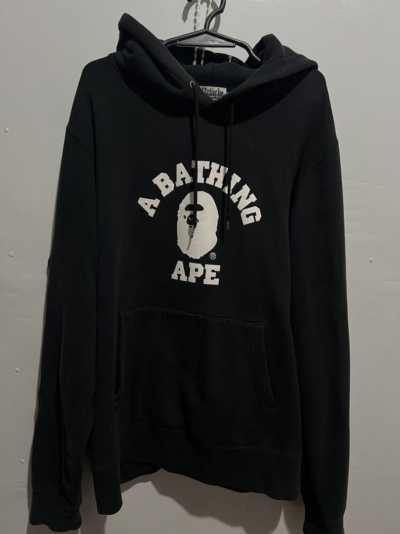 A Bathing Ape BAPE Hoodie Black Size L (Category: Hoodies) located in Pili. Submitted by r.chives (Listing ID 1461628838, Image 1). Description: - Black BAPE hoodie - Features classic ape head logo graphic on the front - Drawstring hood with metal aglets - Size: Large (L) - Ideal for casual wear.