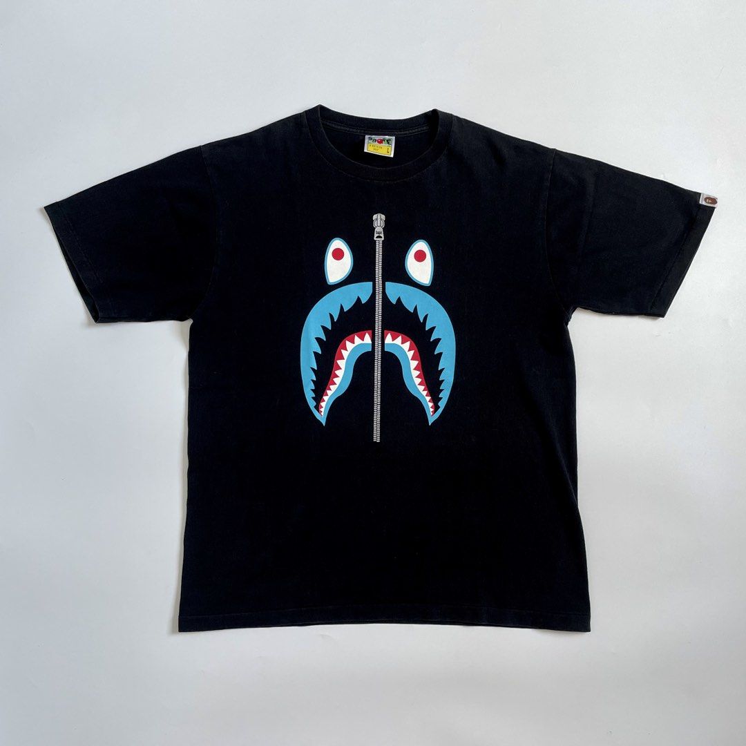 A Bathing Ape Shark Head Shirt (Category: Tshirts & Polo Shirts ) located in Imus. Submitted by streetgrails.ph (Listing ID 1461612913, Image 1). Description: BAPESHARK ZIP TEE 22 x 27 ( size large on tag ) in excellent condition 9/10 color rate no issue! imus cavite loc! 📍 courier/mode of delivery: j&t or lalamove mode of payment: payment first thru gcash only! 📌 no return/refund! 📌 can send proof of legitimacy! .