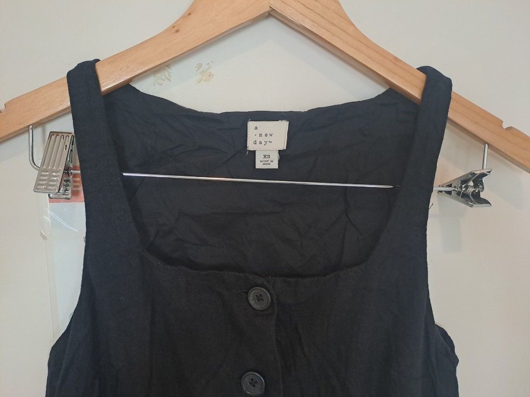 A New Day linen dress (Category: Dresses) located in Manila. Submitted by joanbalde39643 (Listing ID 1461589353, Image 3). Description: This is a black square-neck button-front sleeveless dress top by A New Day, featuring a textured linen fabric and front button closure..
