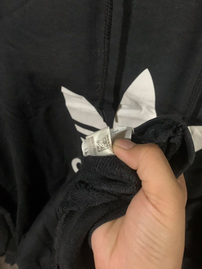 Adidas Black Hoodie (Category: Coats, Jackets and Outerwear) located in Paranaque City. Submitted by thrift_in_the_hoods (Listing ID 1461790426, Image 3). Description: Dimes: 24x26 Size: Large Issue: None .