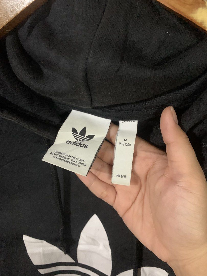 Adidas Black Hoodie (Category: Coats, Jackets and Outerwear) located in Paranaque City. Submitted by thrift_in_the_hoods (Listing ID 1461790426, Image 2). Description: Dimes: 24x26 Size: Large Issue: None .