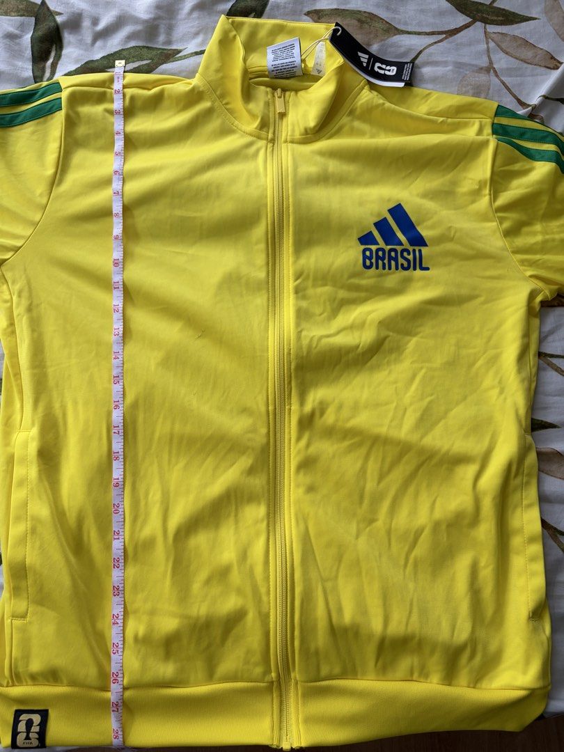 Adidas Brasil WorldCup 26 Track Jacket (Category: Coats, Jackets and Outerwear) located in Manila. Submitted by 1vktry (Listing ID 1461600088, Image 3). Description: - Bought from the US - Length: 28 Inches - Width: 22 inches - Men’s size - Brand New - Can only do delivery by Lalamove.