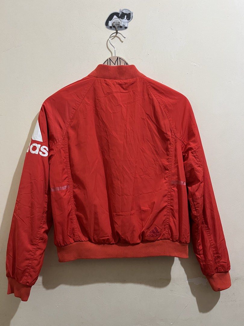 Adidas Red Bomber Jacket with Logo (Category: Coats, Jackets and Outerwear) located in Manila. Submitted by juspheroca82034 (Listing ID 1461684950, Image 2). Description: - Classic red Adidas bomber jacket - Features iconic Adidas logo on sleeve - Full zipper closure - Ribbed collar, cuffs, and hem for a snug fit - Cozy and warm interior lining - Ideal for everyday casual style -for kids 8-10 yrs old.