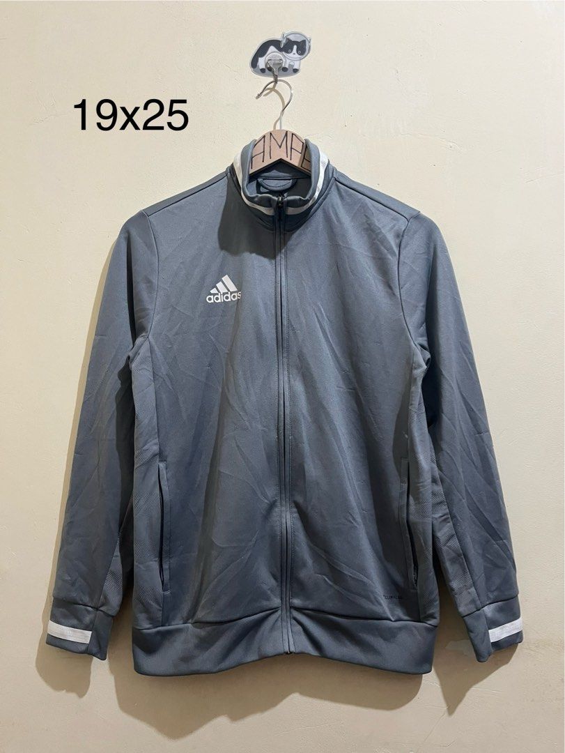 Adidas Track Jacket Grey White Stripes (Category: Coats, Jackets and Outerwear) located in Manila. Submitted by juspheroca82034 (Listing ID 1461682641, Image 1). Description: - Grey Adidas track jacket - White stripes on collar and cuffs - Full zip closure - Two side pockets with zippers - Ideal for sports or casual wear - Comfortable and stylish.