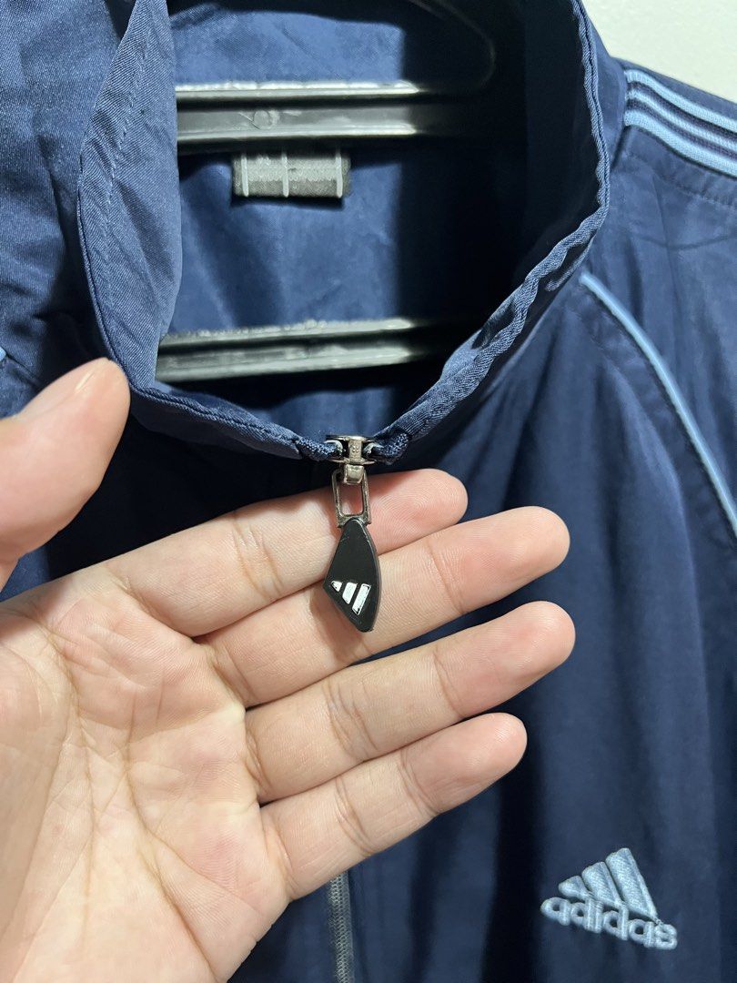 Adidas Vintage Navy Blue Windbreaker (Category: Coats, Jackets and Outerwear) located in Manila. Submitted by jdstrll (Listing ID 1461647239, Image 3). Description: Adidas Vintage Navy Blue Windbreaker Width: 25 inches Length: 28 inches 🚚Mode of Delivery: J&T/Lalamove/Meet up 🫴🏼 Just Made an offer 📦We ship nationwide: Luzon/Visayas/Mindanao 🧾Mode of Payment: Gcash/Landbank/BPI/Gotyme/RCBC ✅ Shipping fee should be shouldered by the buyer. ❌No